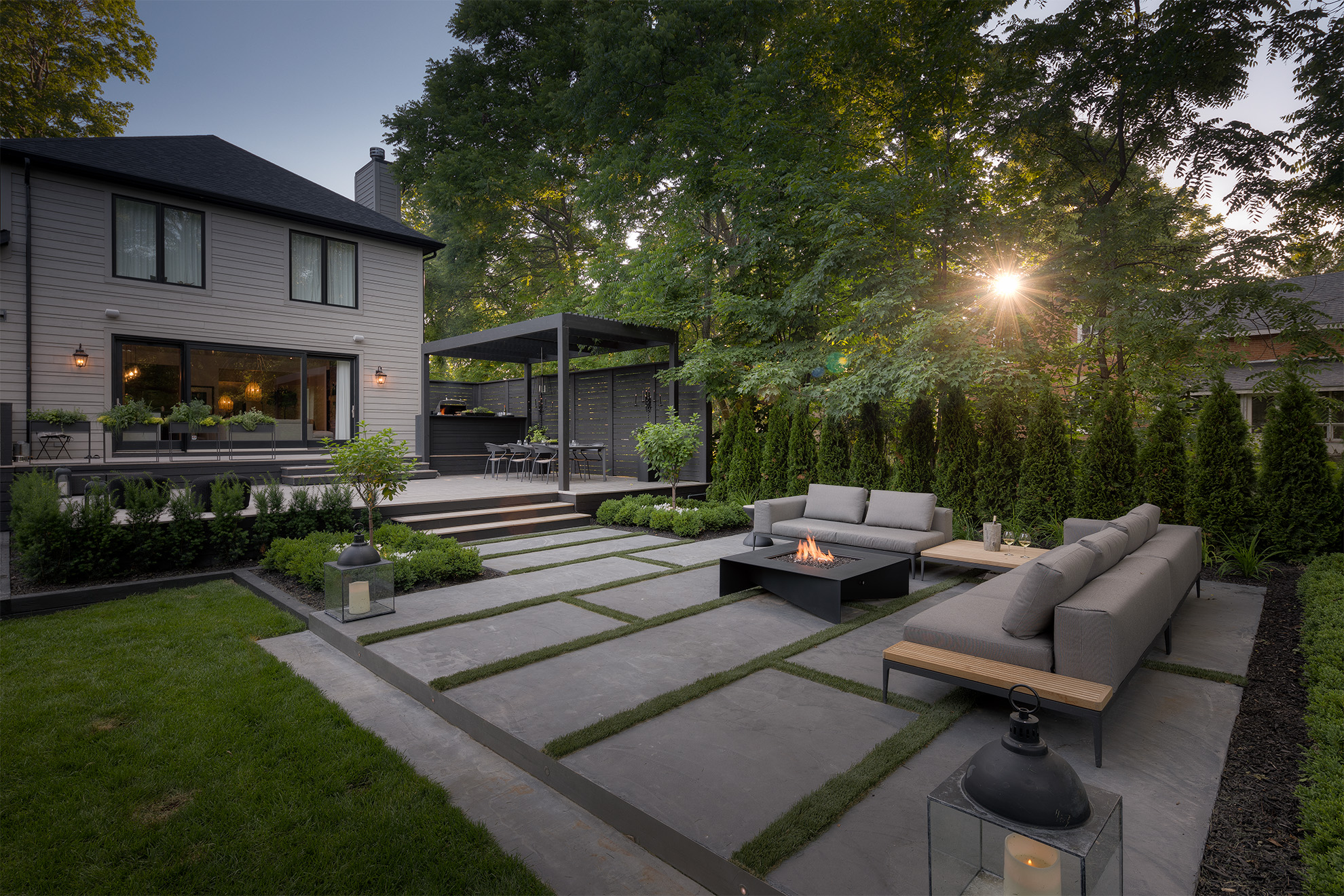 Contemporary home with a fire pit in the outdoor living area.