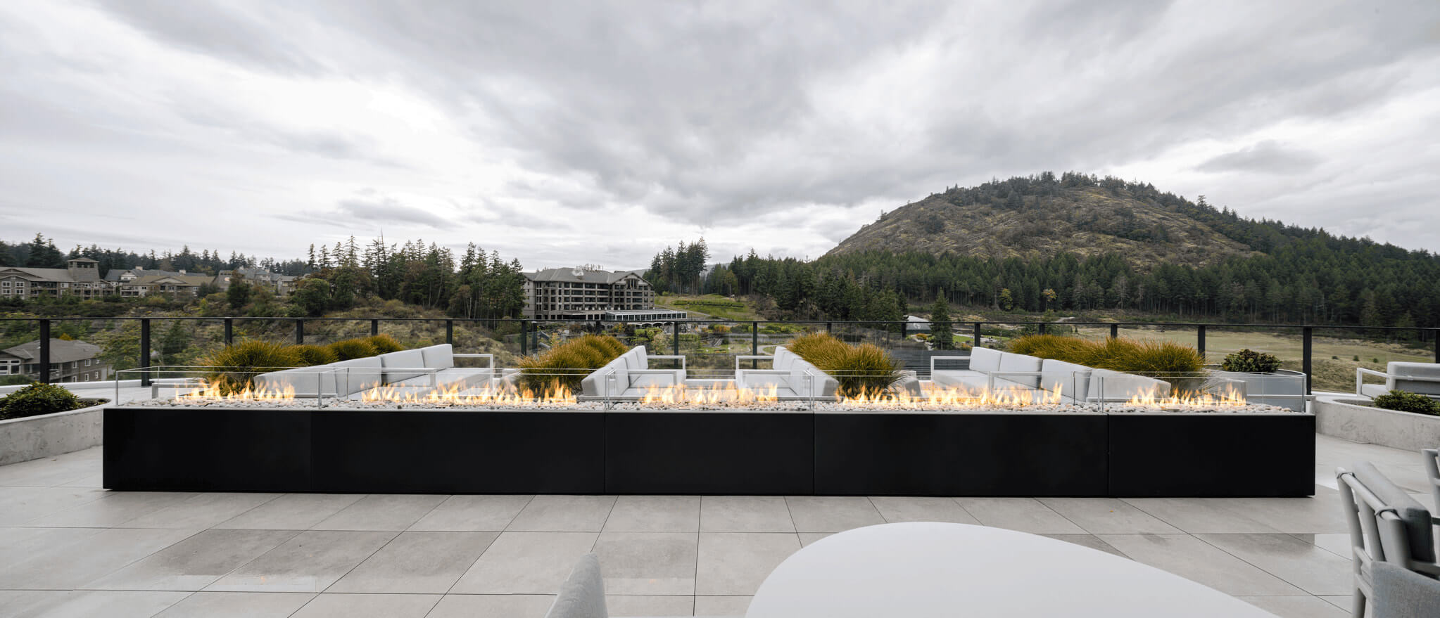 Komodo linear fire pits spanning the main outdoor terrace