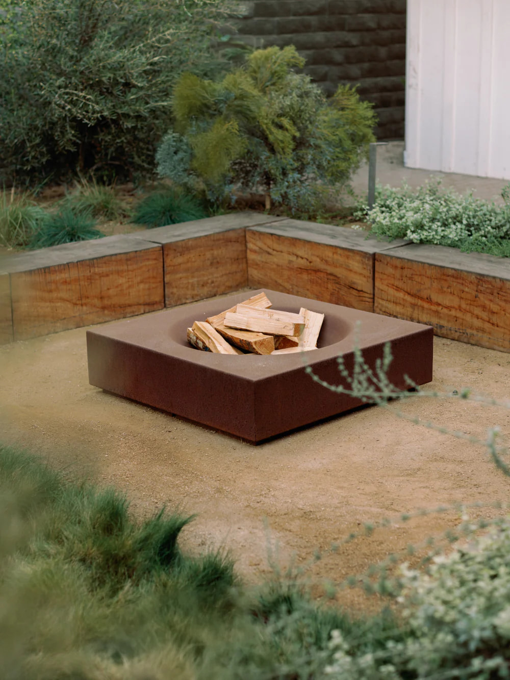 garden with a Paloform fire pit