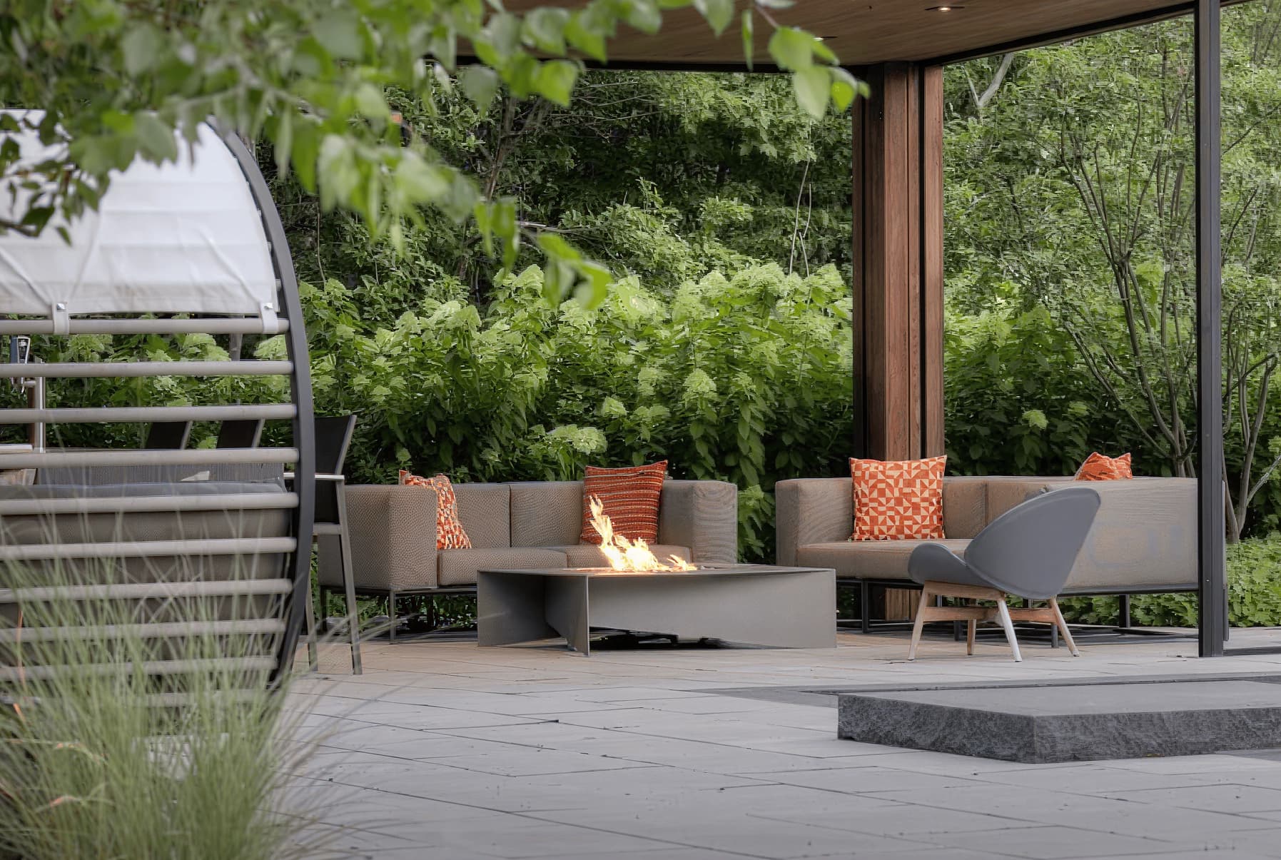 At its center, a Paloform Fold fire table provides a quiet focal point